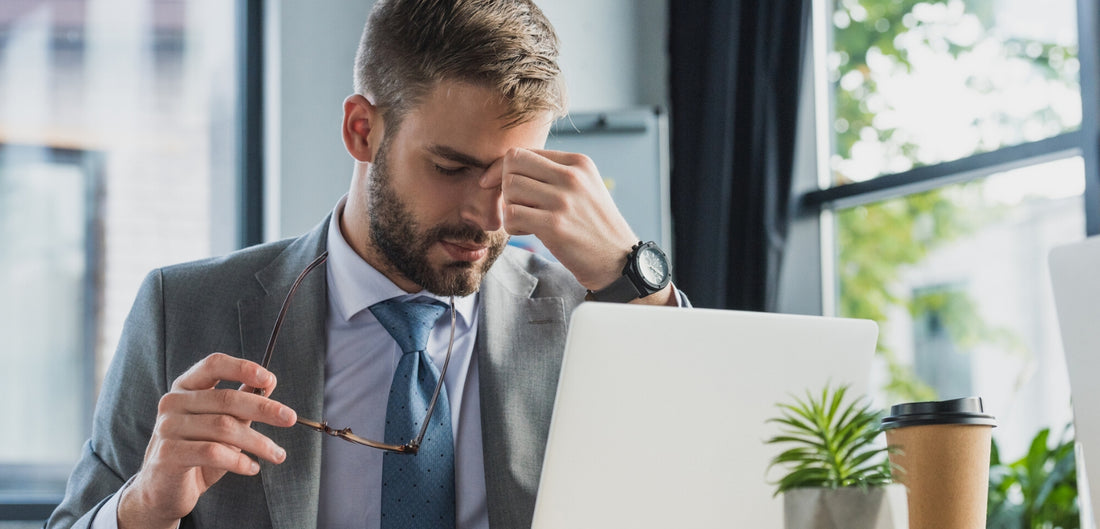 Photo of a tired man at work